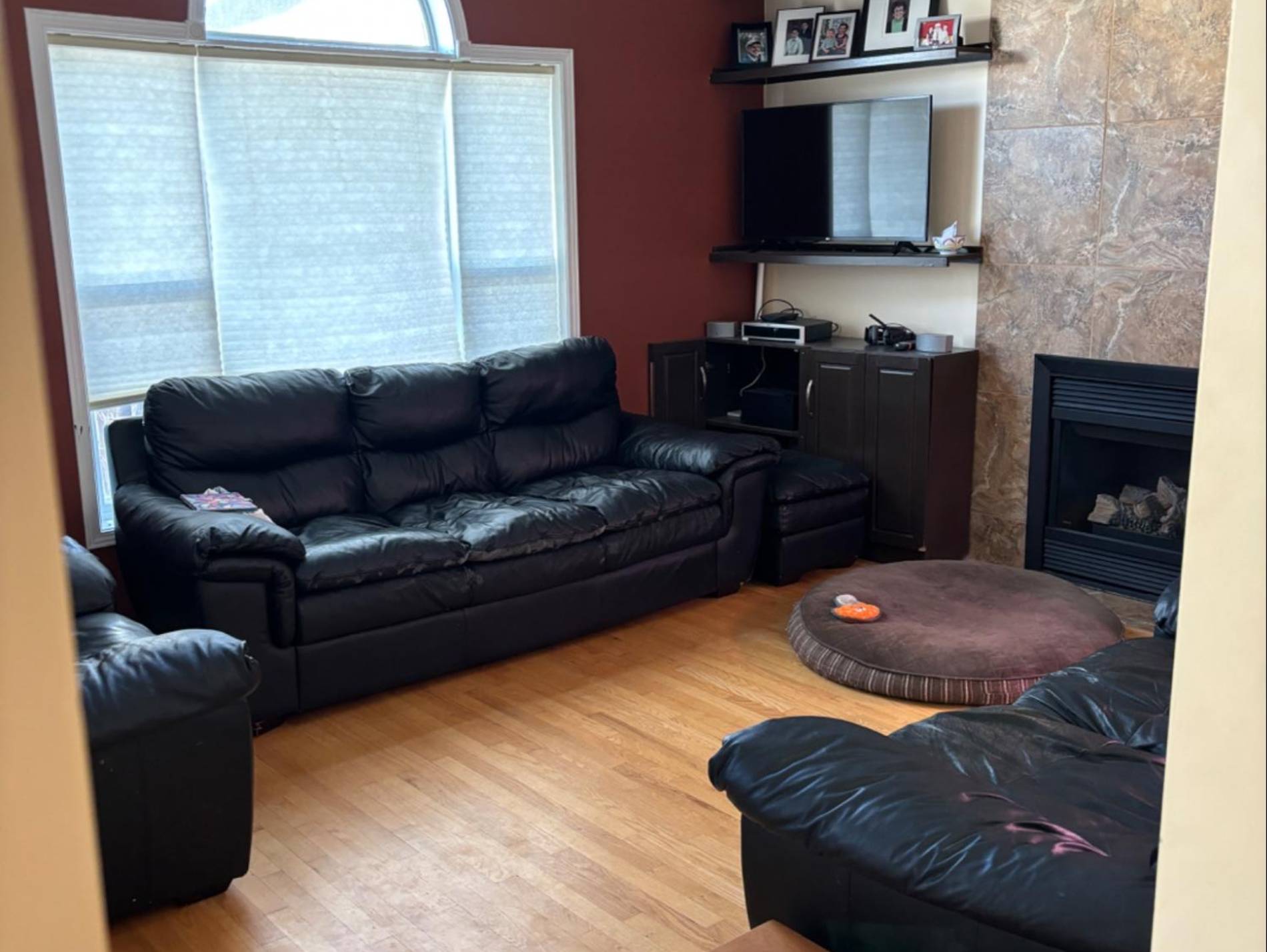 Creating Flow and Function: How Removing Walls Transformed This Orleans Kitchen. Image of before image of living room. with leather couches.