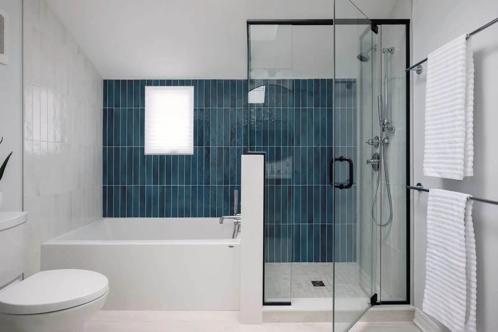 Elevate Your Bathroom with Colour: A Stylish Transformation Awaits. Newly renovated bathroom. With blue shower walls.