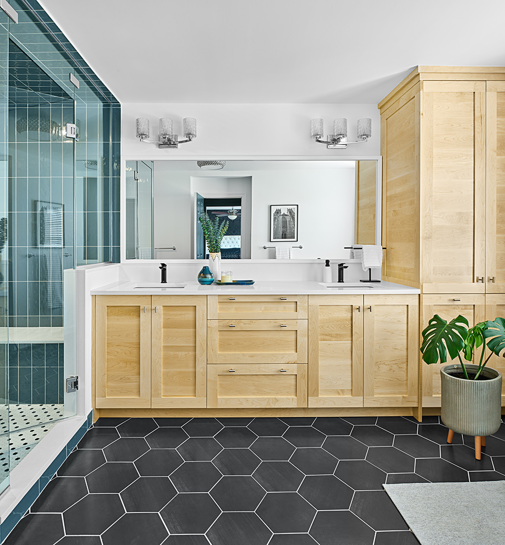 Elevate Your Bathroom with Colour. New bathroom with new wood cabinets and mirror and lighting.