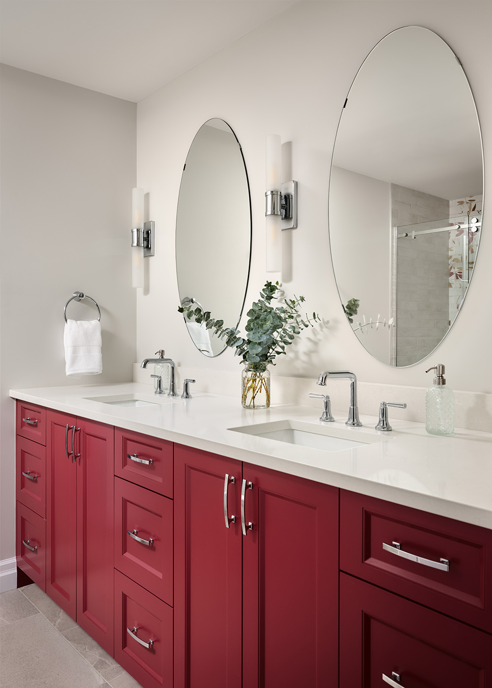 Elevate Your Bathroom with Colour. New bathroom with new wood cabinets and mirror and lighting.