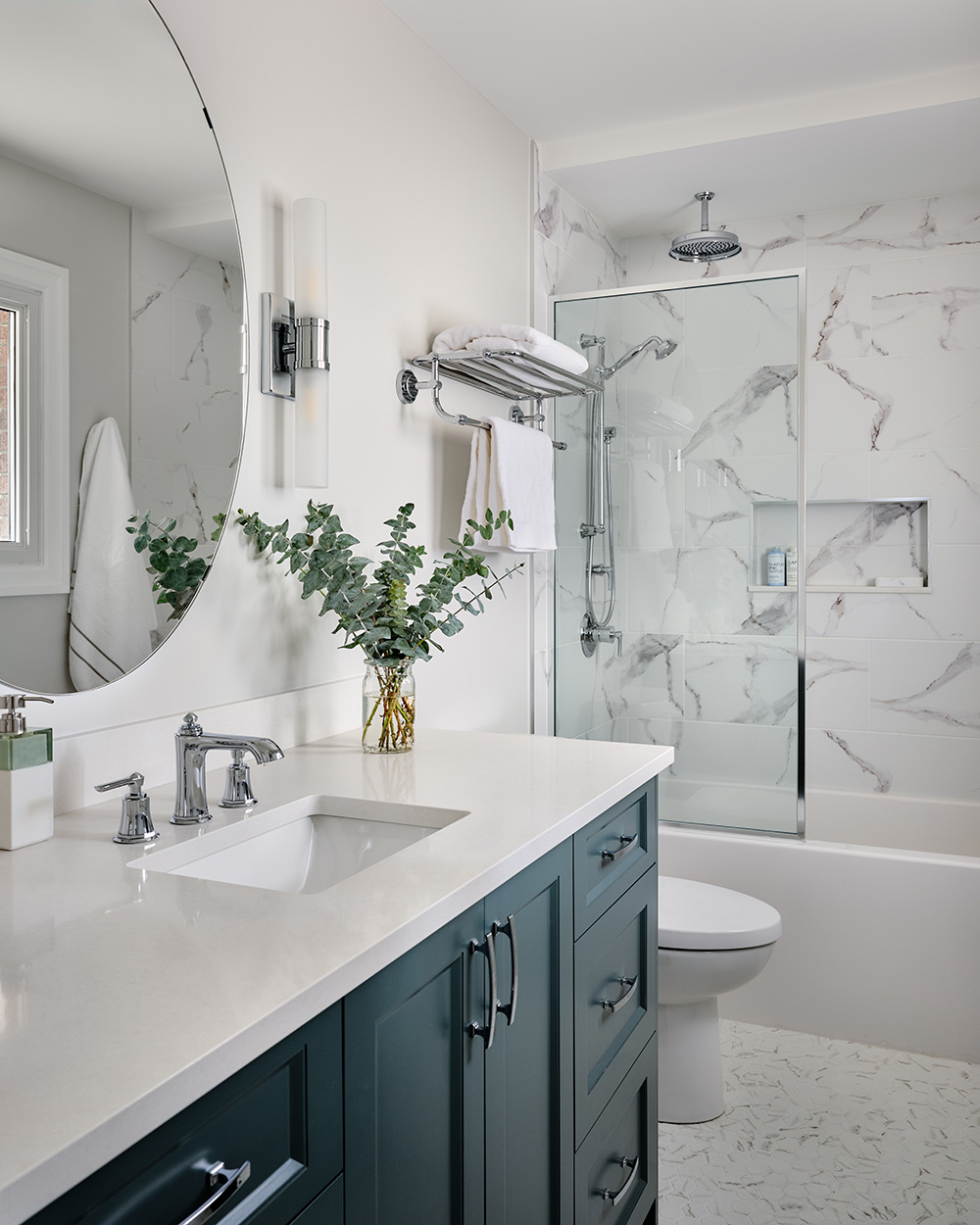 Elevate Your Bathroom with Colour. New bathroom with green cabinets and mirror.